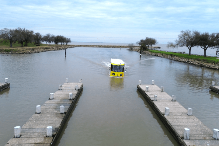 a boat on a river next to a body of water
