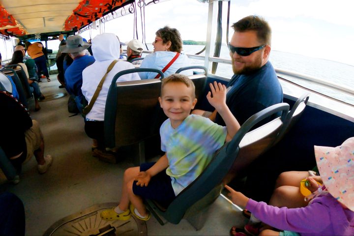 a young boy sitting on a table